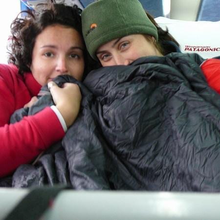 two women getting warm on the bus