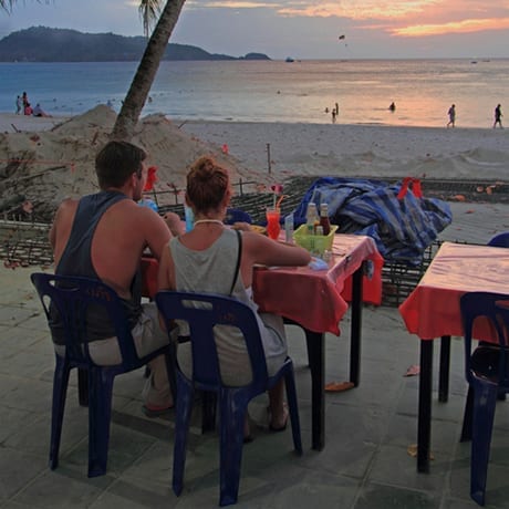 A couple taking diner on the beach