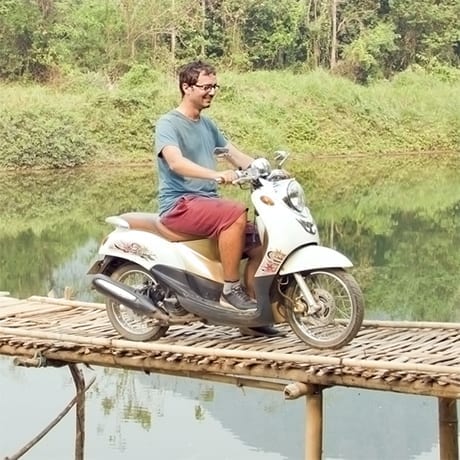 Scooter on a wood bridge