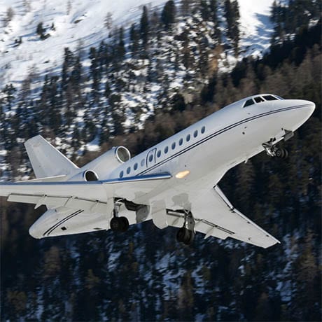 A private jet with snowy moutains in the background